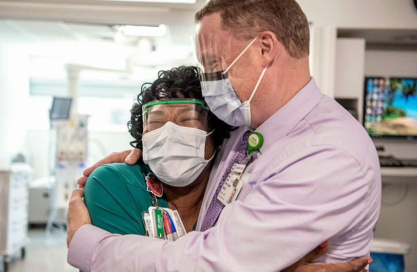 Two caregivers embracing