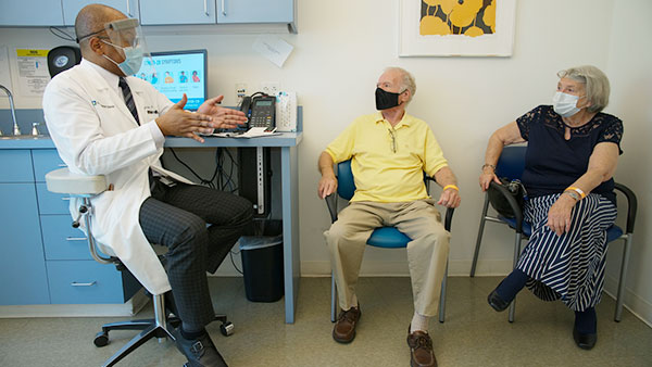 Patient and his wife discuss plan of care with Cleveland Clinic neurologist